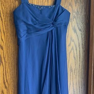 Two navy blue junior bridesmaids dresses.